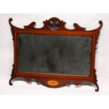 A GEORGE III DESIGN MAHOGANY FRETWORK FRAMED WALL MIRROR, with flower head carved cresting, shell