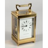 A GOOD TAYLOR & BLIGH, ENGLAND, LLOYDS OF LONDON BRASS FRENCH STYLE CARRIAGE CLOCK, eleven jewels,