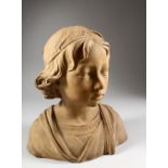 A TERRACOTTA BUST OF AN ITALIAN YOUNG BOY. 12ins high.