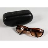 A PAIR OF RALPH LAUREN SUNGLASSES, 1919/5 086/ID 60DIS 130, in a blue Ralph Lauren leather case.