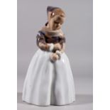 A COPENHAGEN PORCELAIN GROUP OF A YOUNG GIRL in Dutch costume. Pattern 1251. 8ins long.