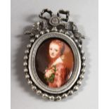 A CLASSICAL OVAL PORTRAIT OF A LADY, in a plate frame with ribbon. 2.5ins x 1.5ins.