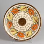 CHARLOTTE RHEAD FOR CROWN DUCAL, a large slip decorated charger, Pattern No. 5623, "Rustic Trellis".