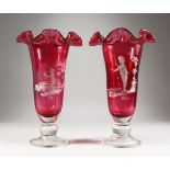 A LARGE PAIR OF CRANBERRY MARY GREGORY VASES. 14ins high.