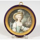 A GOOD FRENCH CIRCULAR MINIATURE PORTRAIT OF A YOUNG LADY, in a gilt and blue enamel frame. 3.5ins