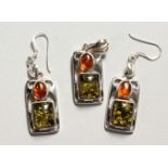 A PAIR OF SILVER AND AMBER EARRINGS, with matching pendant.