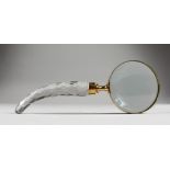 A LARGE MAGNIFYING GLASS, with shaped cut glass handle.