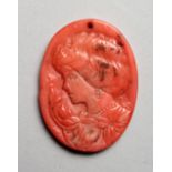 A SMALL RELIEF CARVED CORAL CAMEO PORTRAIT BUST OF A LADY. 1.5ins high.
