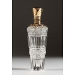 A CUT GLASS SCENT BOTTLE, with 18ct gold top. 3.5ins high.