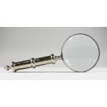 A LARGE MAGNIFYING GLASS, with plain handle.