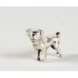 A MINIATURE SILVER DOG. 1ins long.