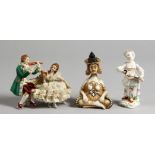A SMALL PORCELAIN FIGURINE OF A GIRL HOLDING A LUTE, a porcelain conversation group and a seated