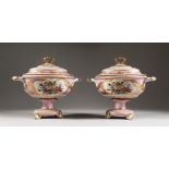 A PAIR OF SEVRES DESIGN PORCELAIN OVAL TUREENS AND COVERS, with reverse panels of musical trophies