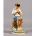 A COPENHAGEN PORCELAIN FIGURE OF A YOUNG BOY sitting on a rock and cutting a stick. Pattern 905. 7.