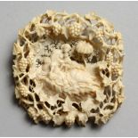 A NICE EUROPEAN CARVED AND PIERCED IVORY BROOCH, surrounded by fruiting vines. 2.25ins.