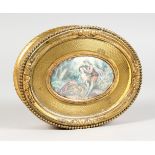 A GOOD FRENCH OVAL GILT METAL JEWELLERY BOX, the lid with young lovers. 6ins long.