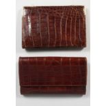 A CROCODILE LEATHER PURSE AND SIMILAR WALLET. 6.5ins wide.