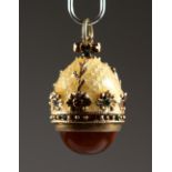 A RUSSIAN SILVER AND ENAMEL MINIATURE EGG PENDANT. 0.75ins high.