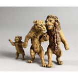A VIENNA STYLE COLD PAINTED BRONZE OF A LION FAMILY. 3.25ins long.