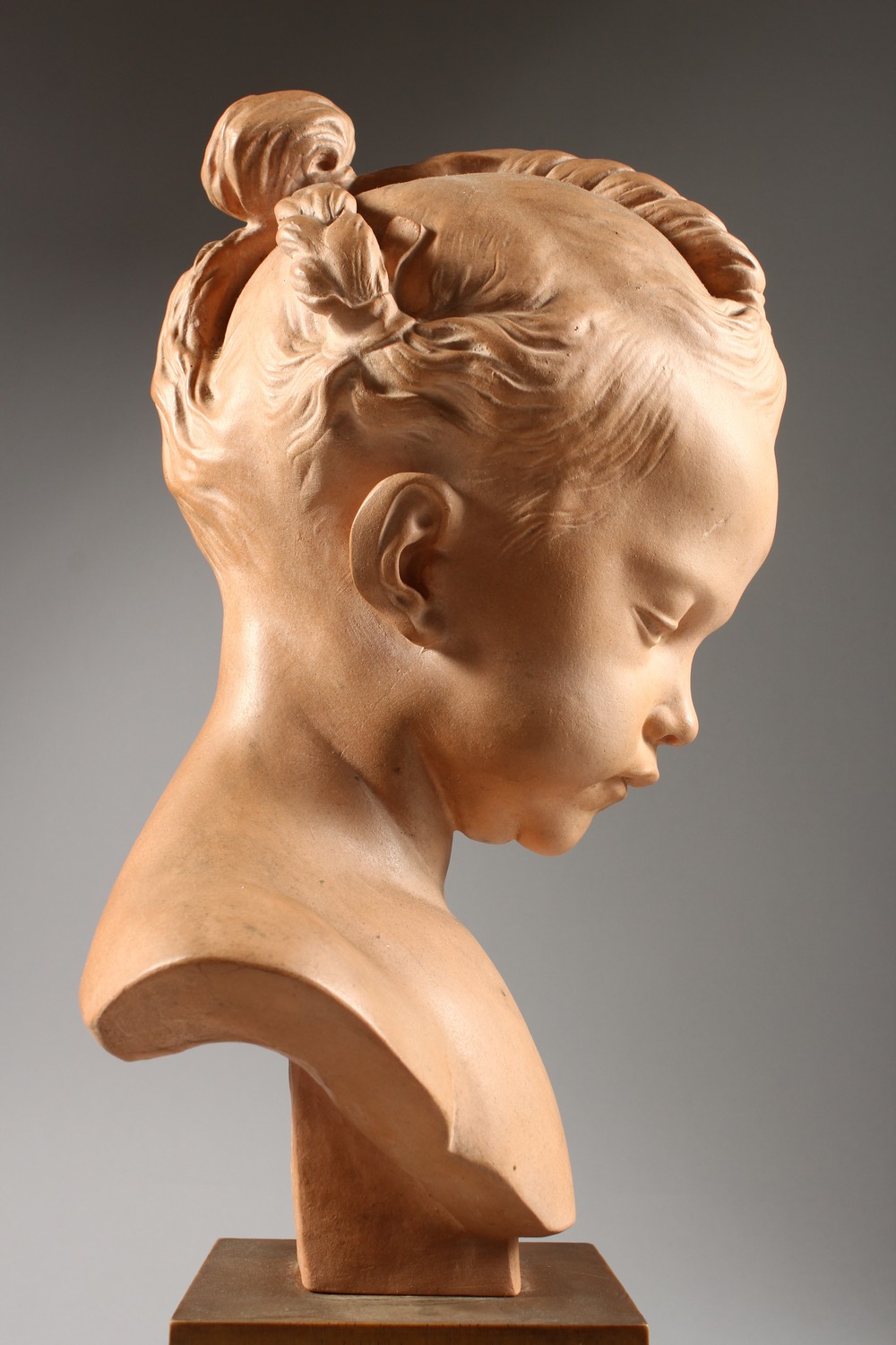 SALY A GOOD TERRACOTTA BUST OF A YOUNG GIRL, on a wooden plinth. Signed Saly, Louvre. 14ins high. - Image 6 of 7