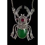 A SILVER JADE SET SCARAB PENDANT on chain.