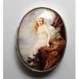 A SILVER OVAL SNUFF BOX, the lid with an enamel of a young maiden. 2.25ins.