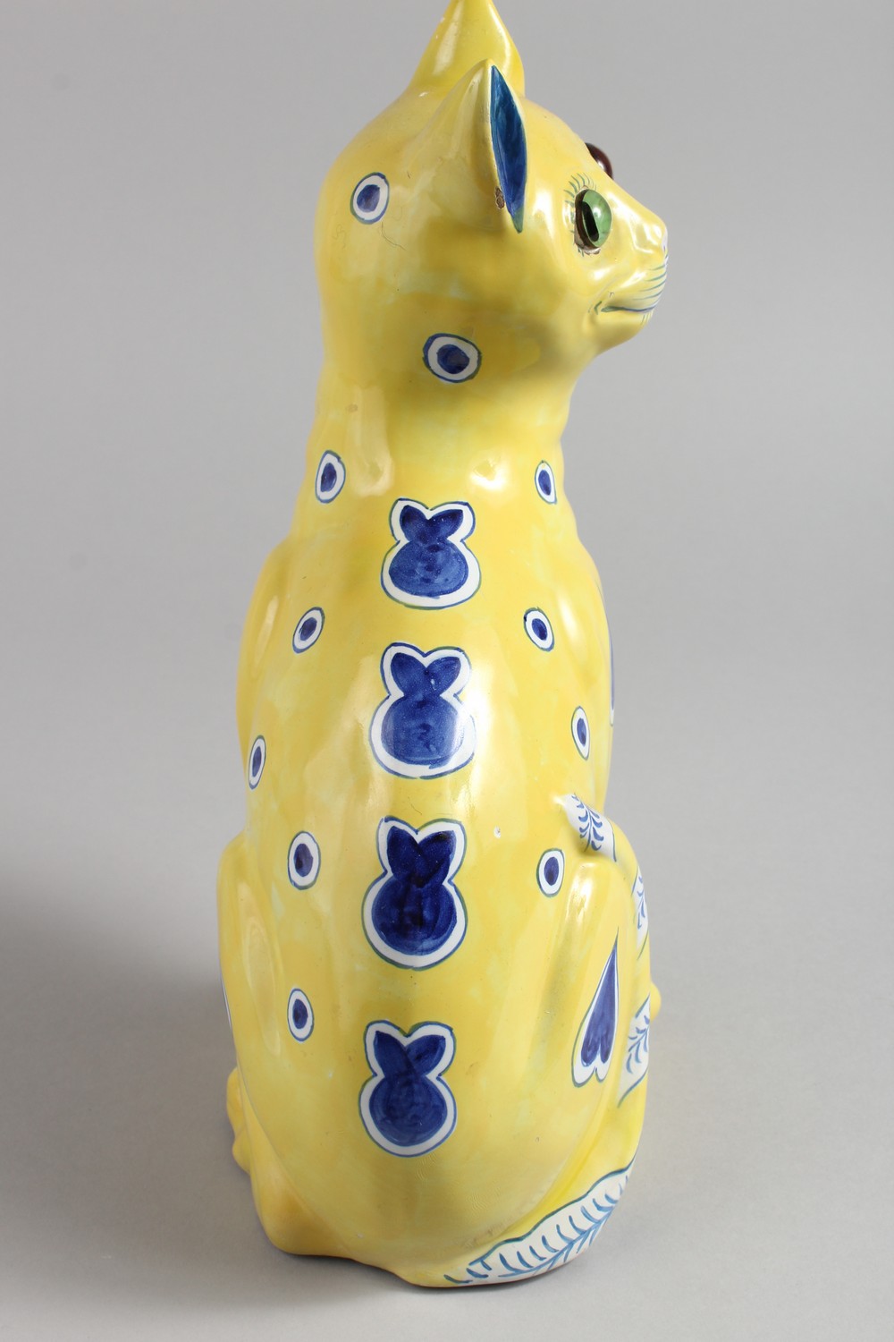 AFTER GALLE, A GOOD POTTERY SEATED CAT, yellow ground with blue painted stylised emblems and green - Image 3 of 9