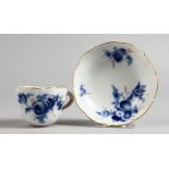 A SMALL MEISSEN CUP AND SAUCER, painted in blue and gilt with sprays of flowers. Saucer: 4ins
