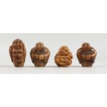 FOUR CHINESE CARVED BONE FIGURAL NETSUKES. 1.5ins high.