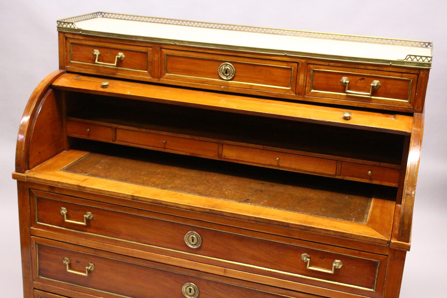 A 19TH CENTURY CONTINENTAL FRUITWOOD CYLINDER BUREAU, with brass galleried marble top, over three - Image 12 of 16