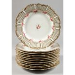 A SET OF THREE PLATES, sprigged with roses. 9ins diameter.