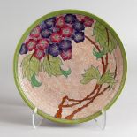 CHARLOTTE RHEAD FOR CROWN DUCAL, a slip decorated circular charger, Pattern No. 784158, painted with