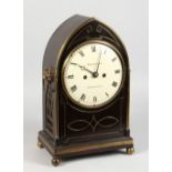 A GOOD REGENCY MAHOGANY CASED ARCHED TOP BRACKET CLOCK by THOMPSON, WOODBRIDGE, white circular dial,