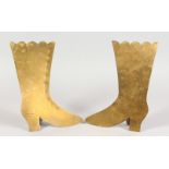 A PAIR OF BRASS "FOLK ART" MODELS OF BOOTS. 9.5ins high.