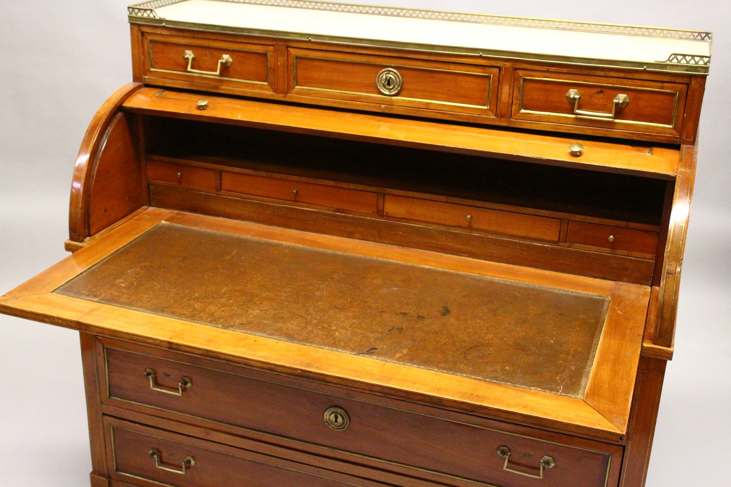 A 19TH CENTURY CONTINENTAL FRUITWOOD CYLINDER BUREAU, with brass galleried marble top, over three - Image 13 of 16