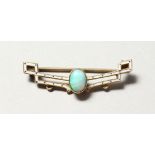 A SMALL GOLD, ENAMEL AND OPAL BAR BROOCH.