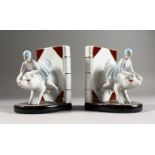 A PAIR OF ART DECO DESIGN BOOKENDS, lady riding a pig. 6ins high.