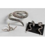 A SILVER AND MARCASITE SNAKE BRACELET, EARRINGS AND RING.