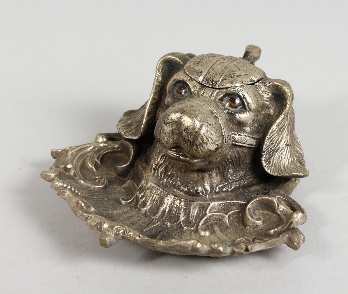 A CAST SILVER-PLATED DOG INKWELL.