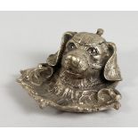 A CAST SILVER-PLATED DOG INKWELL.