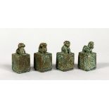 A SET OF FOUR CHINESE BRONZE SEALS. 1.5ins high.