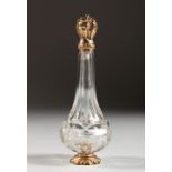 A CUT GLASS SCENT BOTTLE, with 18ct gold top and base. 4.5ins high.