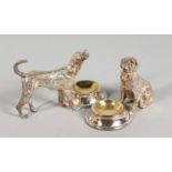 TWO SILVER-PLATED DOG SALTS.