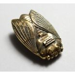 A NOVELTY BRASS SCARAB VESTA CASE. 2.25ins.