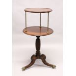 A GOOD REGENCY MAHOGANY CIRCULAR TWO TIER DUMB WAITER with turned brass column supports, the base