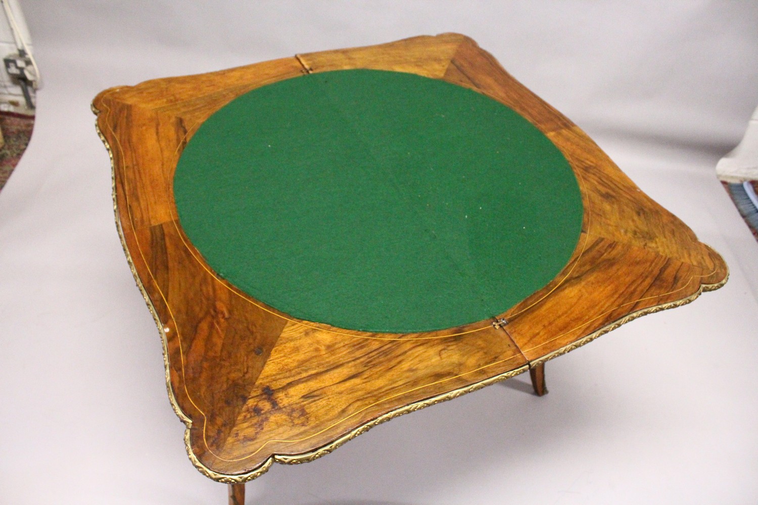 A 19TH CENTURY FRENCH WALNUT, MARQUETRY AND ORMOLU CARD TABLE, with serpentine folding top, shaped - Image 5 of 5