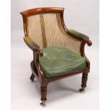 A GOOD REGENCY MAHOGANY BERGERE LIBRARY ARMCHAIR, of typical form, with green leather upholstered