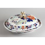 A GOOD LARGE 19TH CENTURY IRONSTONE DISH AND COVER, decorated in the Imari colours. 16.5ins wide.