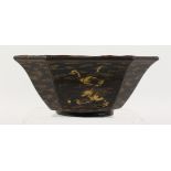 A CHINESE GILT DECORATED LACQUER BOWL. 9ins wide.