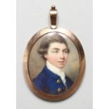 A GEORGIAN OVAL PORTRAIT MINIATURE OF A GENTLEMAN, blue coat and white shirt, the reverse of the